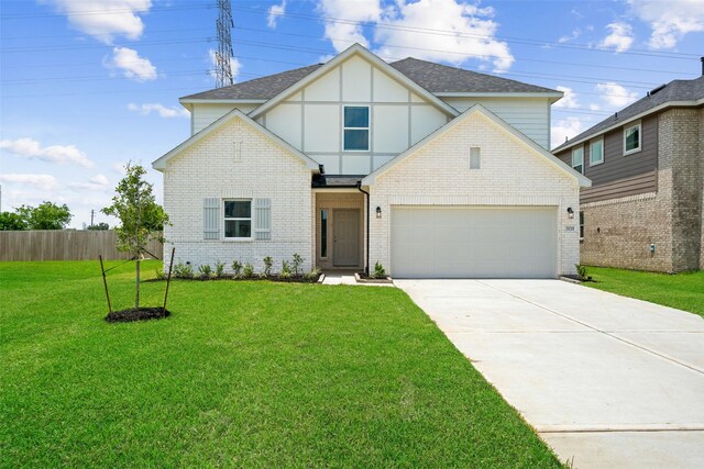 3211 Falling Brook Dr, Baytown, TX 77521 - tudor home with driveway, roof with shingles, brick siding, and a garage