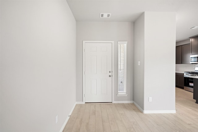 3211 Falling Brook Dr, Baytown, TX 77521 - entrance foyer featuring light wood-type flooring and baseboards