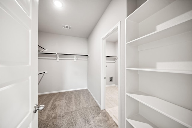 3211 Falling Brook Dr, Baytown, TX 77521 - spacious closet with carpet floors