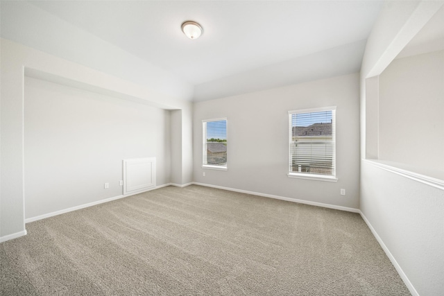 3211 Falling Brook Dr, Baytown, TX 77521 - unfurnished room featuring carpet floors, baseboards, and vaulted ceiling