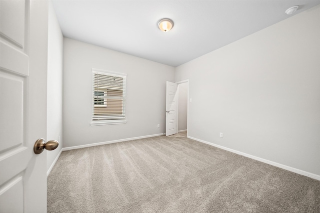 3211 Falling Brook Dr, Baytown, TX 77521 - empty room featuring carpet floors, baseboards, and a smoke detector