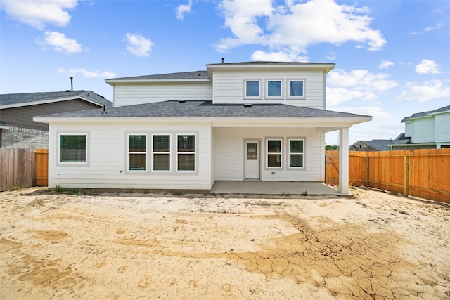 3211 Falling Brook Dr, Baytown, TX 77521 - rear view of house featuring a patio area, a fenced backyard, and a shingled roof