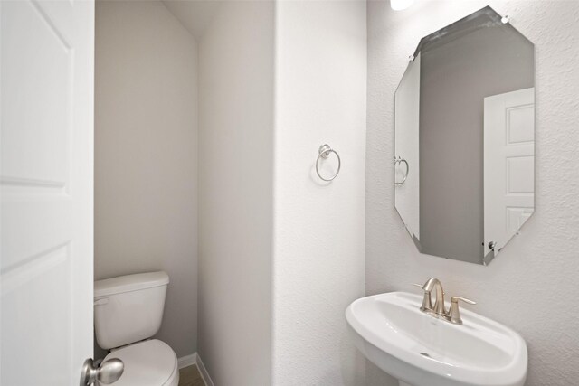 3211 Falling Brook Dr, Baytown, TX 77521 - bathroom with a sink and toilet