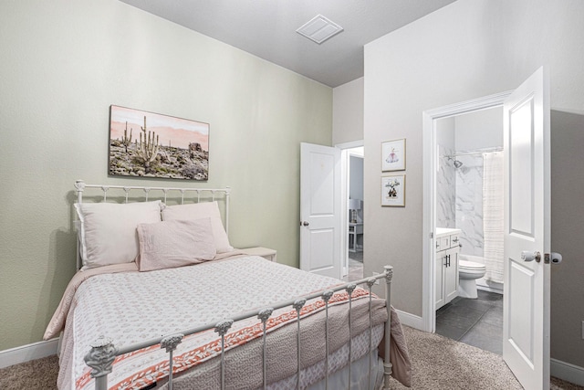 3423 Crescent Vista Dr, Fulshear, TX 77441 - bedroom with dark colored carpet, baseboards, and ensuite bathroom