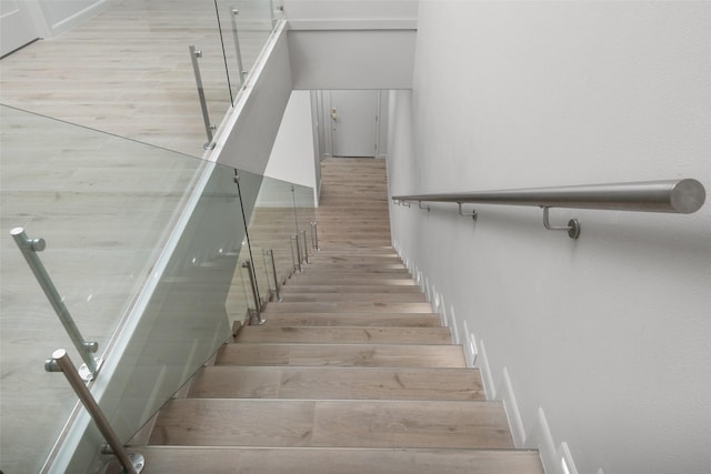 5606 Circe Cir Unit A, South Padre Island, TX 78597 - staircase with wood finished floors