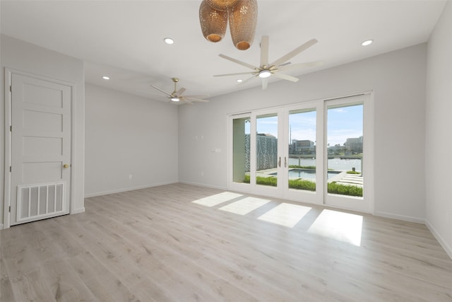 5606 Circe Cir Unit A, South Padre Island, TX 78597 - unfurnished room with recessed lighting, light wood-style floors, ceiling fan, baseboards, and a water view