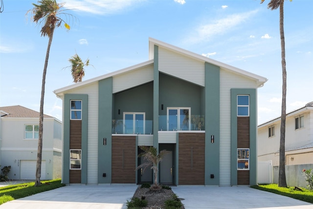 5606 Circe Cir Unit A, South Padre Island, TX 78597 - contemporary house with driveway and stucco siding
