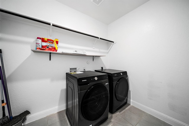 2334 Calm Channel Ct, Missouri City, TX 77459 - laundry room with independent washer and dryer, baseboards, and tile patterned floors