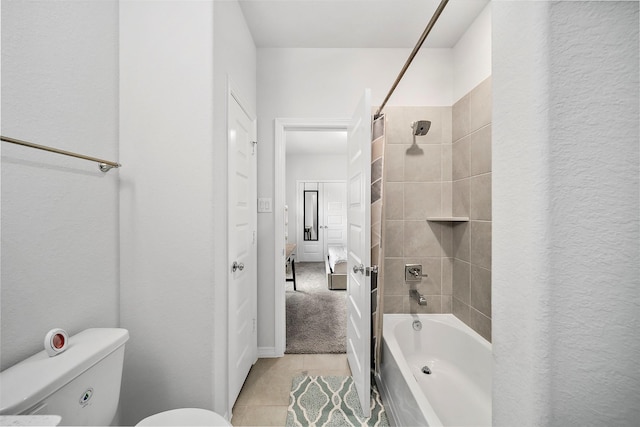 2334 Calm Channel Ct, Missouri City, TX 77459 - bathroom featuring toilet, washtub / shower combination, and tile patterned floors
