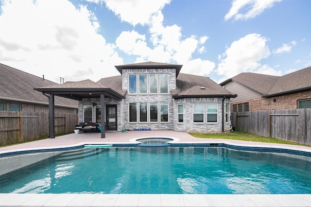 2334 Calm Channel Ct, Missouri City, TX 77459 - view of pool with a patio, a fenced backyard, and a pool with connected hot tub