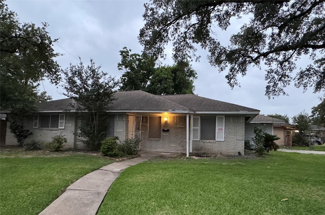 1102 Laurentide St, Houston, TX 77029 - single story home featuring a front lawn and brick siding