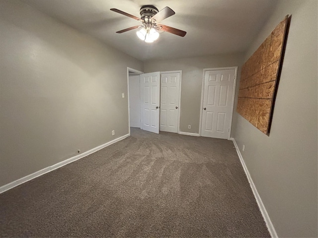 1102 Laurentide St, Houston, TX 77029 - unfurnished bedroom featuring baseboards, dark colored carpet, and ceiling fan