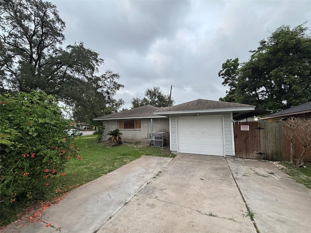 1102 Laurentide St, Houston, TX 77029 - view of front of home featuring driveway, central AC unit, and brick siding