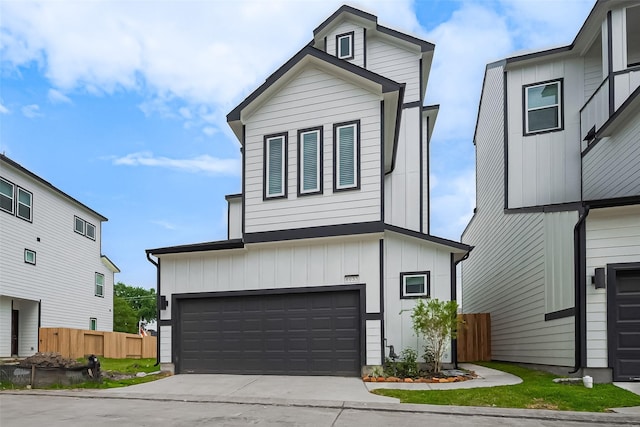 8933 Grovner Pl, Houston, TX 77055 - view of front of property featuring a garage, board and batten siding, and driveway
