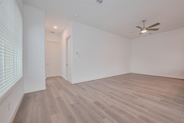 8933 Grovner Pl, Houston, TX 77055 - empty room with ceiling fan, light wood-style floors, baseboards, and recessed lighting
