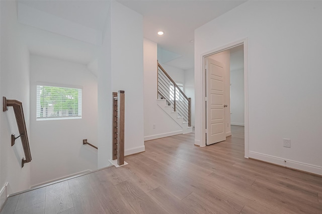 8933 Grovner Pl, Houston, TX 77055 - stairway featuring wood finished floors, recessed lighting, and baseboards