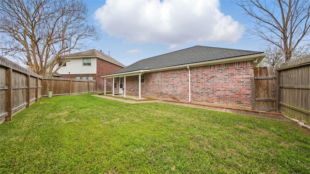 906 Juniper Ct, Tomball, TX 77375 - rear view of property featuring brick siding, roof with shingles, and a patio