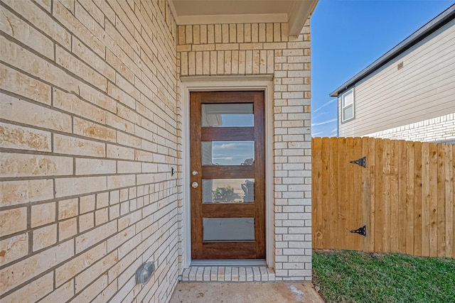 10155 Red Snapper Rd, Magnolia, TX 77354 - doorway to property featuring brick siding