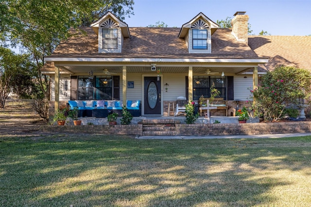 90 Fishermans Bend Dr, Point Blank, TX 77364 - view of front of home with a front yard, a chimney, covered porch, and roof with shingles