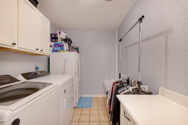 90 Fishermans Bend Dr, Point Blank, TX 77364 - washroom featuring cabinet space, independent washer and dryer, light tile patterned floors, and a textured ceiling