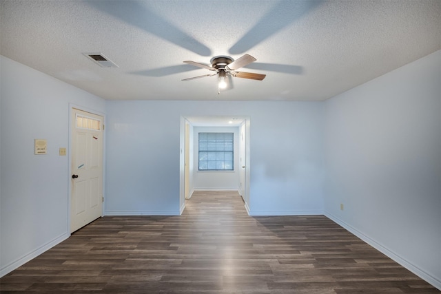 90 Fishermans Bend Dr, Point Blank, TX 77364 - unfurnished room featuring a ceiling fan, dark wood-style floors, a textured ceiling, and baseboards