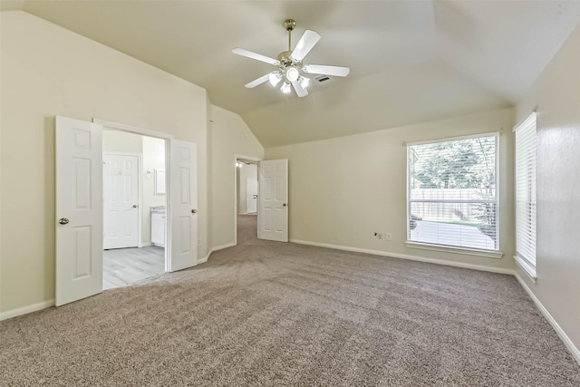 3506 Hickory Hill Ln, Montgomery, TX 77356 - unfurnished bedroom featuring vaulted ceiling, carpet flooring, baseboards, and connected bathroom