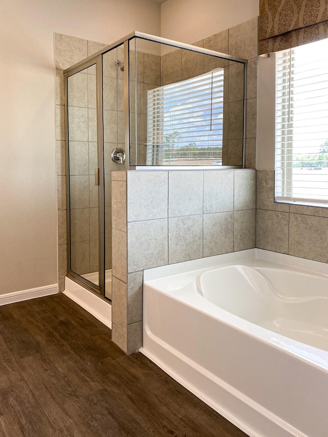 2220 Manila Ln, Texas City, TX 77568 - full bath featuring a bath, wood finished floors, and a shower stall