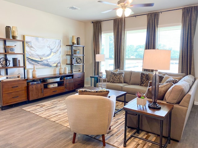 2220 Manila Ln, Texas City, TX 77568 - living room featuring ceiling fan, healthy amount of natural light, and light wood-style flooring
