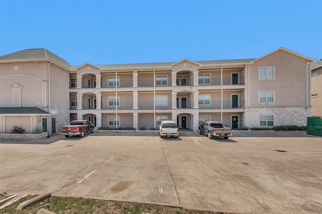 7039 Kingston Cove Ln Unit 309, Willis, TX 77318 - view of building exterior featuring uncovered parking
