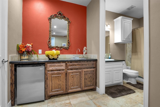 7039 Kingston Cove Ln Unit 309, Willis, TX 77318 - bathroom with vanity, toilet, and tile patterned flooring