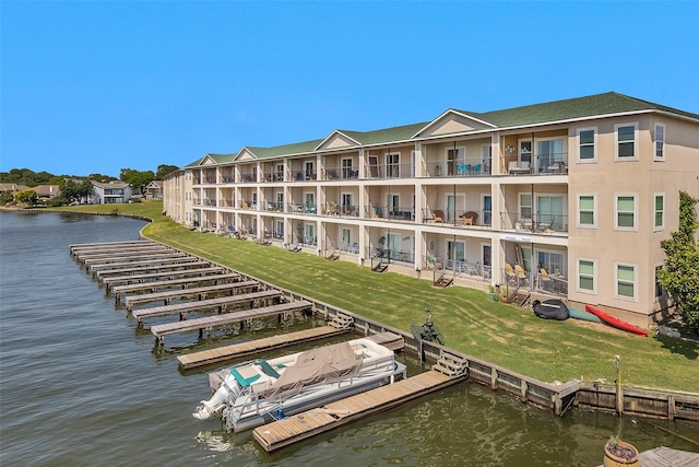 7039 Kingston Cove Ln Unit 309, Willis, TX 77318 - view of apartment building / complex with a water view