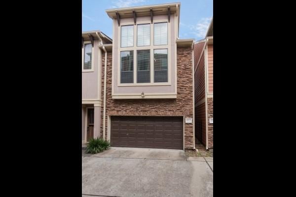 1042 W 23rd St Unit D, Houston, TX 77008 - view of front of property featuring a garage and driveway