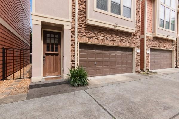 1042 W 23rd St Unit D, Houston, TX 77008 - doorway to property with a garage and concrete driveway