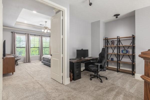1042 W 23rd St Unit D, Houston, TX 77008 - office area featuring carpet, a chandelier, a tray ceiling, and baseboards