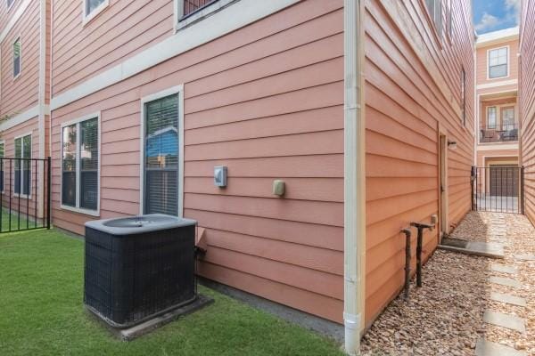 1042 W 23rd St Unit D, Houston, TX 77008 - view of side of property featuring central air condition unit