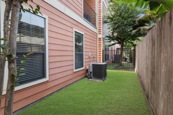 1042 W 23rd St Unit D, Houston, TX 77008 - view of side of home with central air condition unit