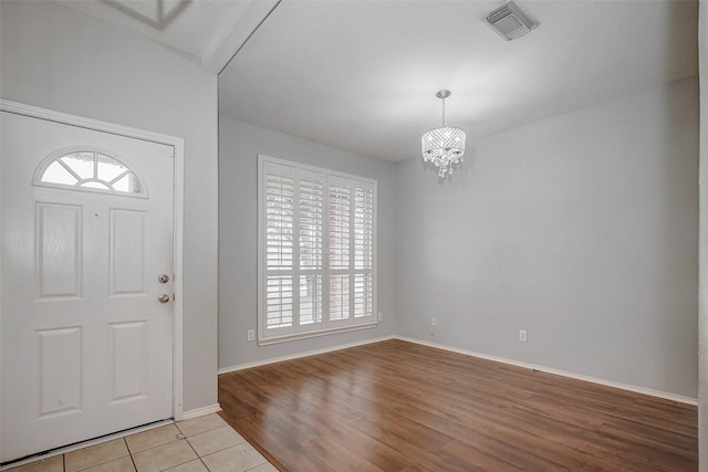 2710 Marigny Dr, Houston, TX 77014 - entryway featuring plenty of natural light, a chandelier, and baseboards