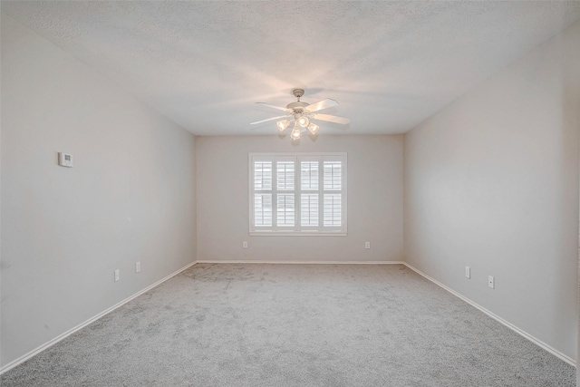 2710 Marigny Dr, Houston, TX 77014 - empty room with a ceiling fan, carpet, baseboards, and a textured ceiling