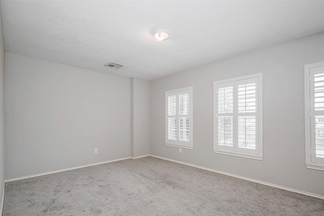 2710 Marigny Dr, Houston, TX 77014 - empty room with plenty of natural light, carpet floors, and baseboards