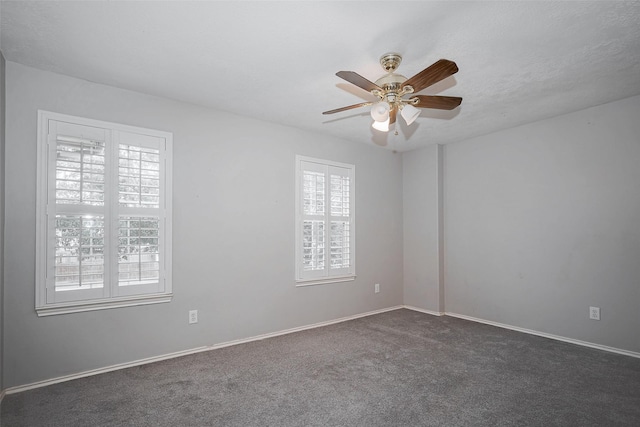 2710 Marigny Dr, Houston, TX 77014 - empty room featuring carpet flooring, a ceiling fan, and baseboards