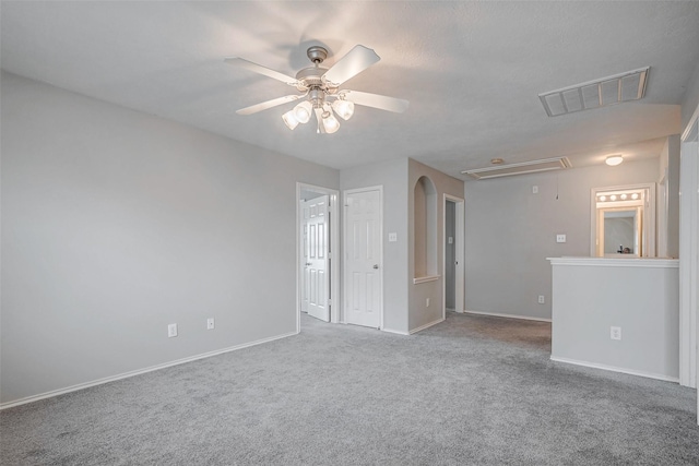 2710 Marigny Dr, Houston, TX 77014 - unfurnished room featuring attic access, a ceiling fan, carpet, and baseboards