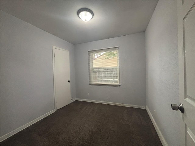 6210 Annunciation St, Houston, TX 77016 - empty room with dark carpet and baseboards