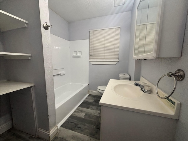 6210 Annunciation St, Houston, TX 77016 - bathroom featuring vanity, toilet, wood finished floors, and shower / tub combination