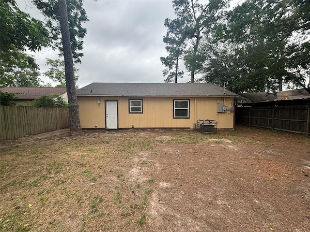 6210 Annunciation St, Houston, TX 77016 - back of house featuring central AC and a fenced backyard