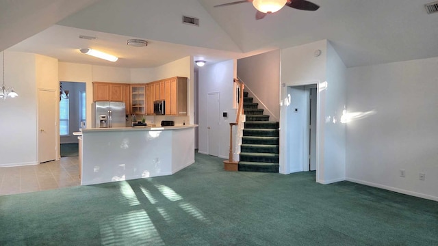 11143 Dawn Harvest Dr, Houston, TX 77064 - kitchen with appliances with stainless steel finishes, glass insert cabinets, light carpet, lofted ceiling, and a ceiling fan