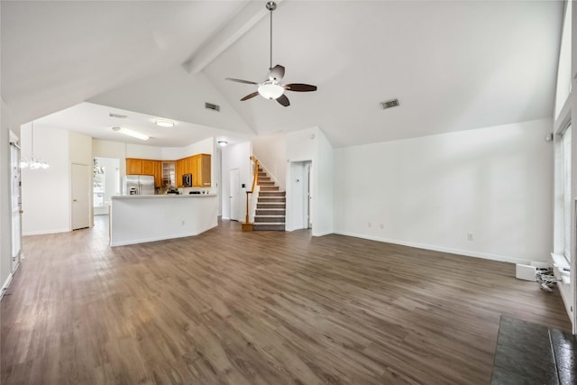 11143 Dawn Harvest Dr, Houston, TX 77064 - unfurnished living room featuring ceiling fan, beamed ceiling, wood finished floors, stairs, and high vaulted ceiling