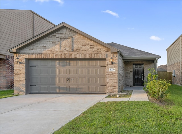 6230 El Cobre Dr, Houston, TX 77048 - view of front of house featuring an attached garage, brick siding, driveway, a shingled roof, and a front lawn