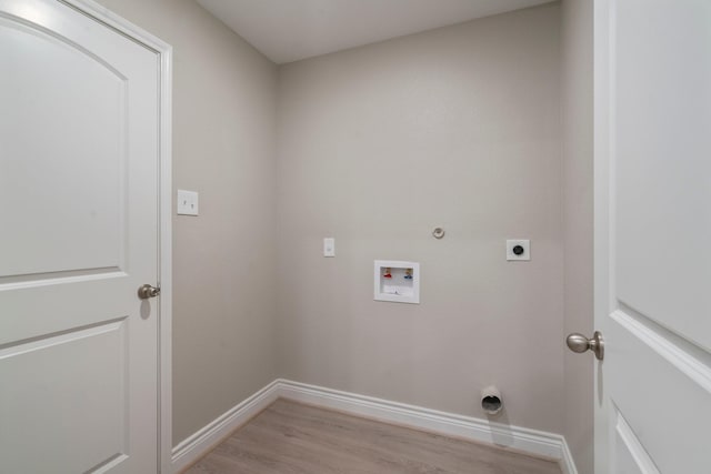 6230 El Cobre Dr, Houston, TX 77048 - washroom with electric dryer hookup, hookup for a washing machine, baseboards, light wood-style floors, and gas dryer hookup