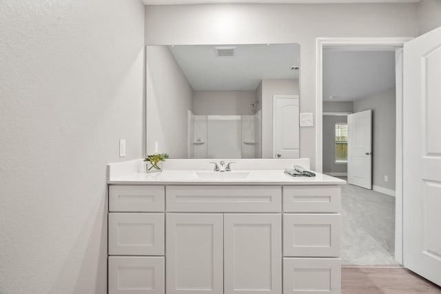 6230 El Cobre Dr, Houston, TX 77048 - full bathroom featuring vanity, a shower, and baseboards