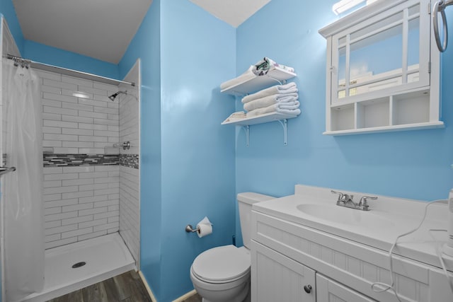 2350 Hawk Mdws, Pearland, TX 77581 - full bathroom with toilet, tiled shower, vanity, and wood finished floors